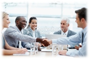 People Shaking Hands Across Table